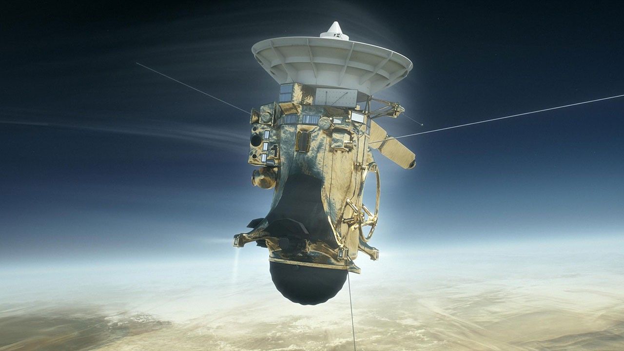 Cassini spacecraft above a hazy horizon