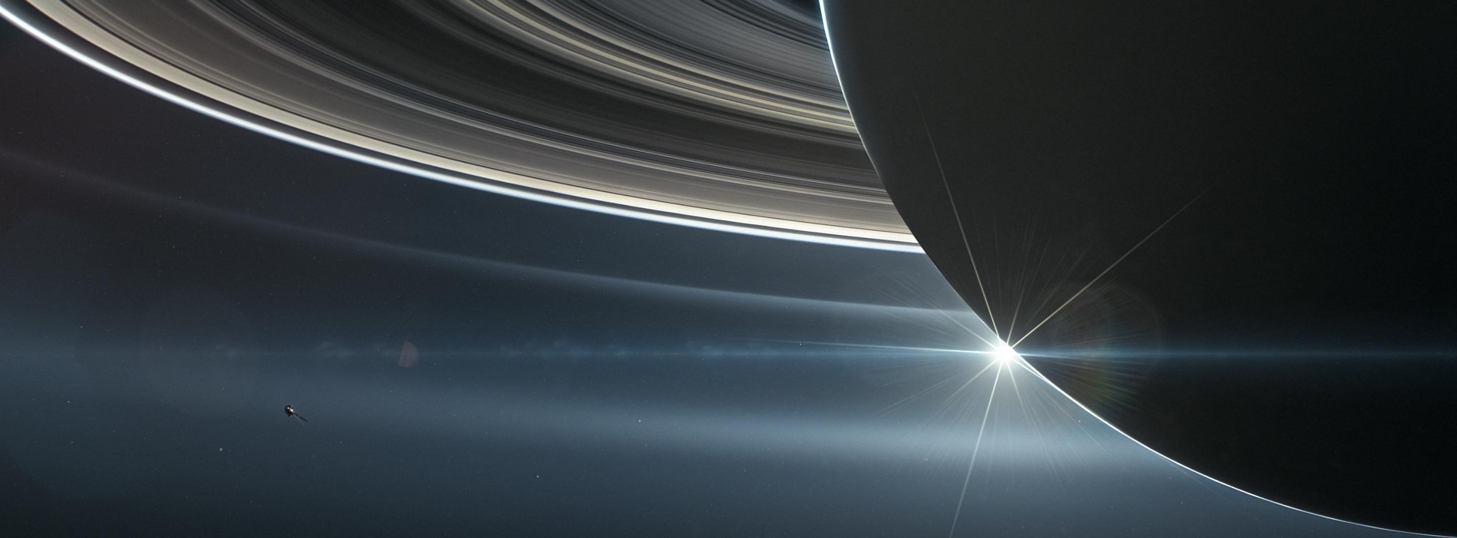 Saturn and its rings lit from behind