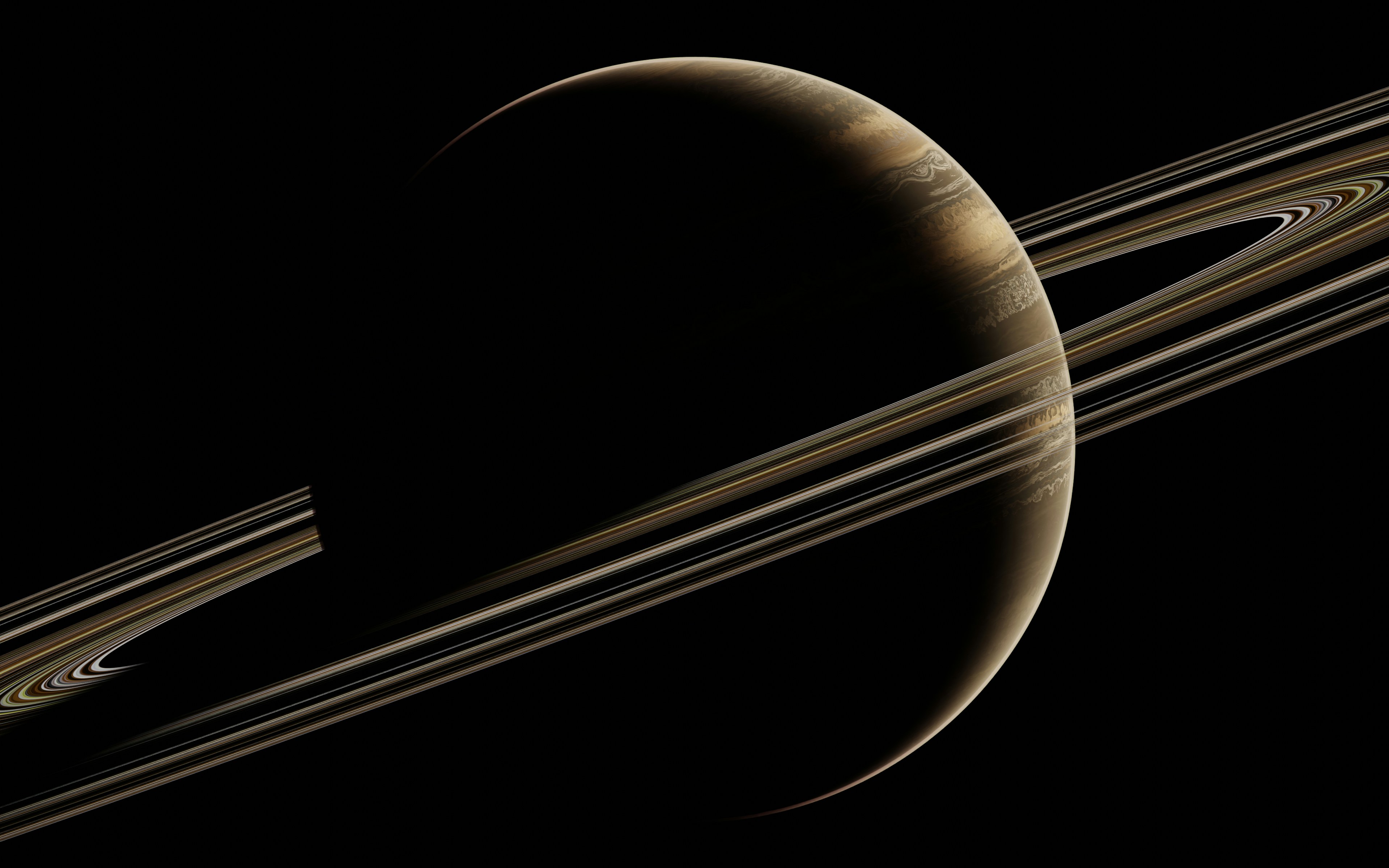 Dark view of Saturn with bright rings